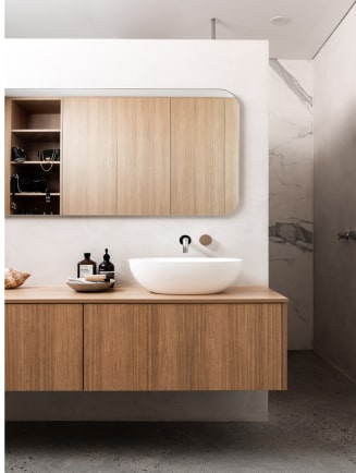 Wood tone wall hung bathroom vanity