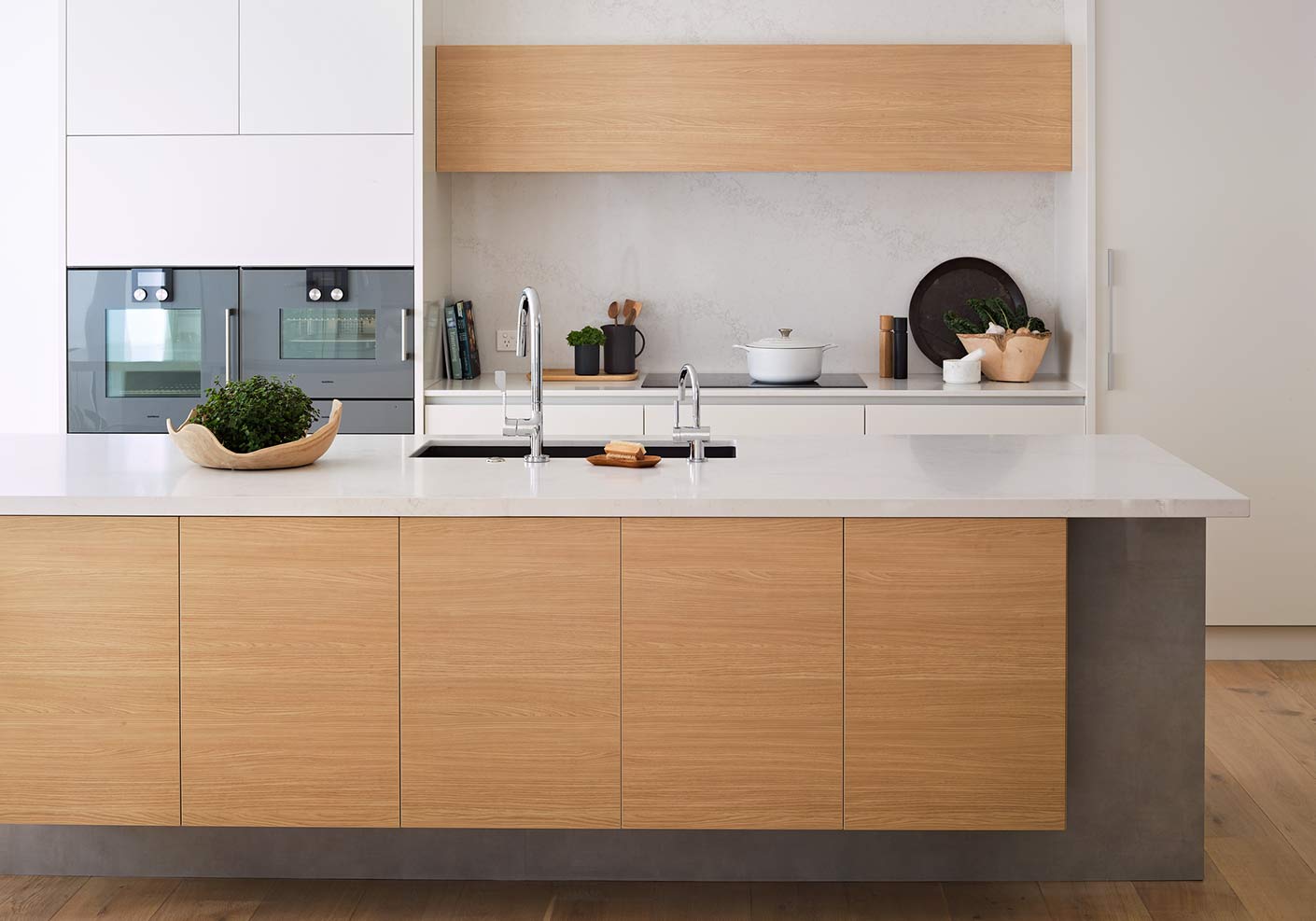 Sleek timber tone and white kitchen