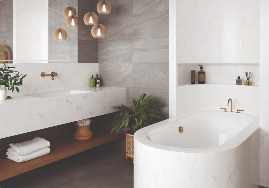 Bathroom with white acrylic bathtub, sink, splashback